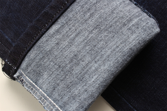 11.8 Oz Cross Slub Cotton Mixed Spandex Blue Denim Fabric For Man Jeans Stretch India Market Style Desizing Fleecing ผ้าใบสีฟ้าสําหรับผู้ชาย เสื้อเดนม์ยีนส์กระชับ สไตล์ตลาดอินเดีย